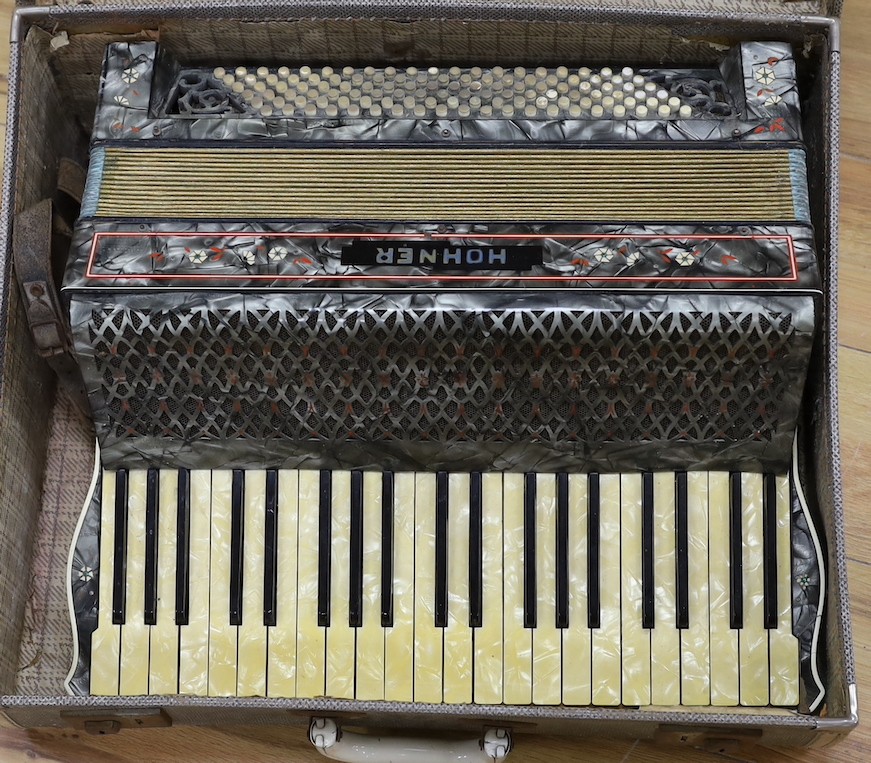 A cased Hohner accordion, Case 57cms wide.